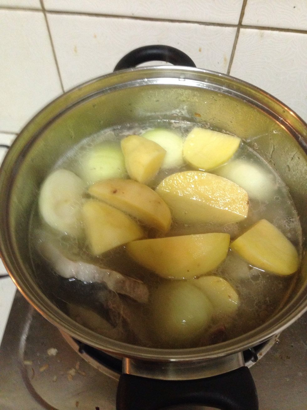 Pour in the potatoes and onions