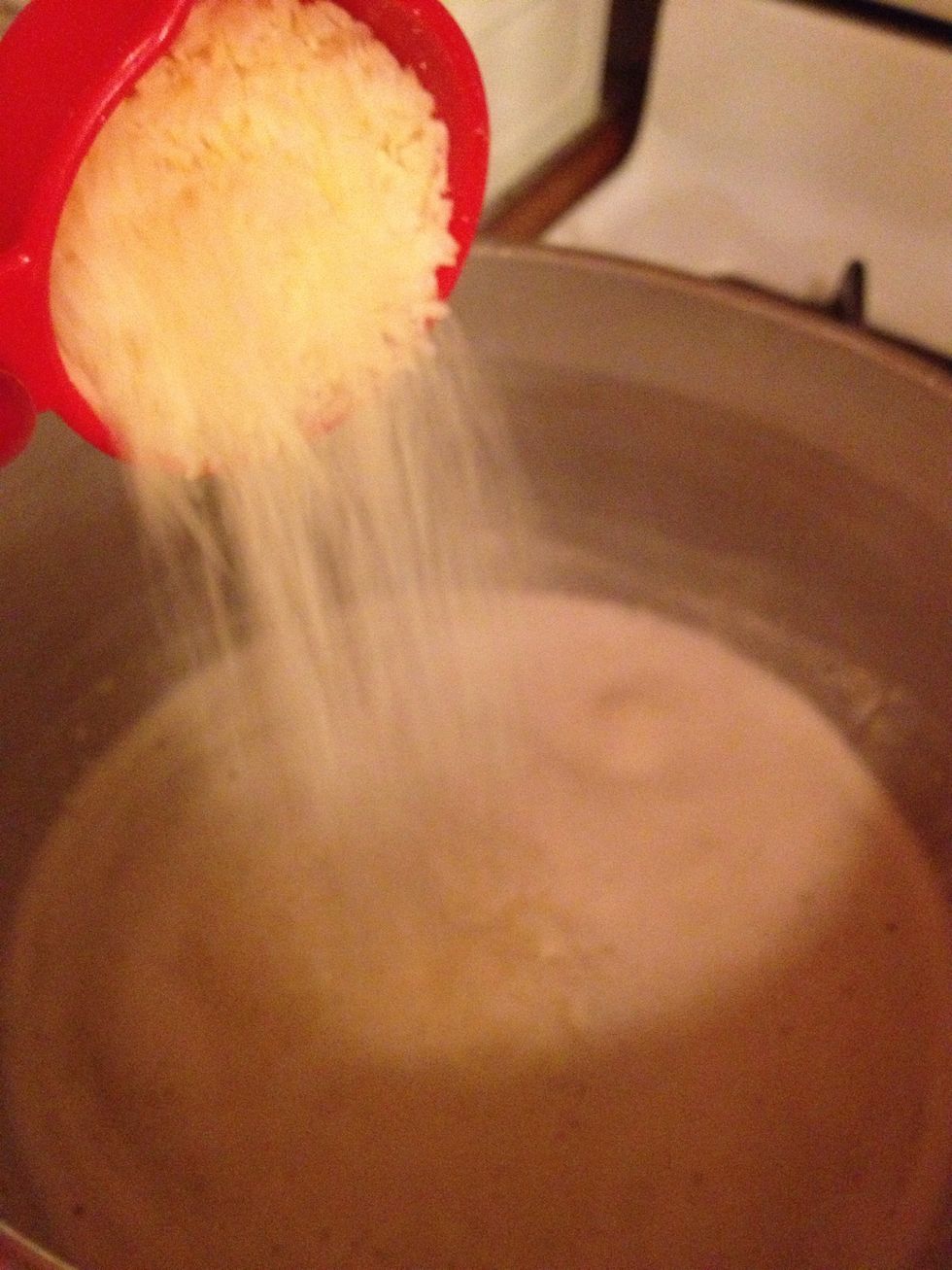 Pour in the salt, garlic salt, black pepper and Parmesan cheese....let it thicken.
