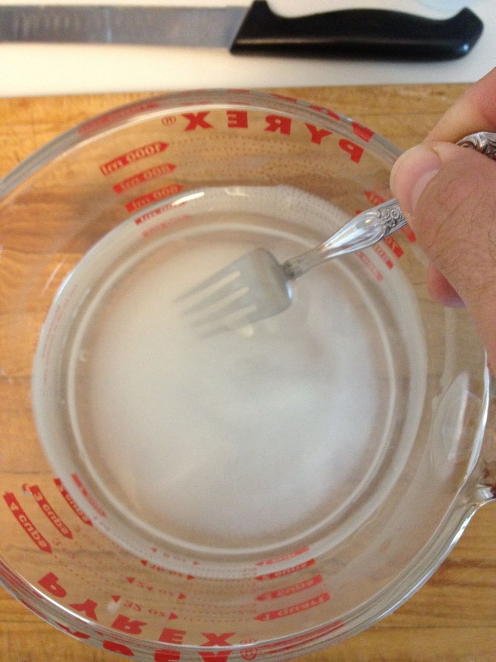 Pour in the sugar and stir until clear. Using hot tap water allows the sugar to dissolve faster. Do not pour hot mixture into a cold glass feeder. Let it stand and cool a little first.