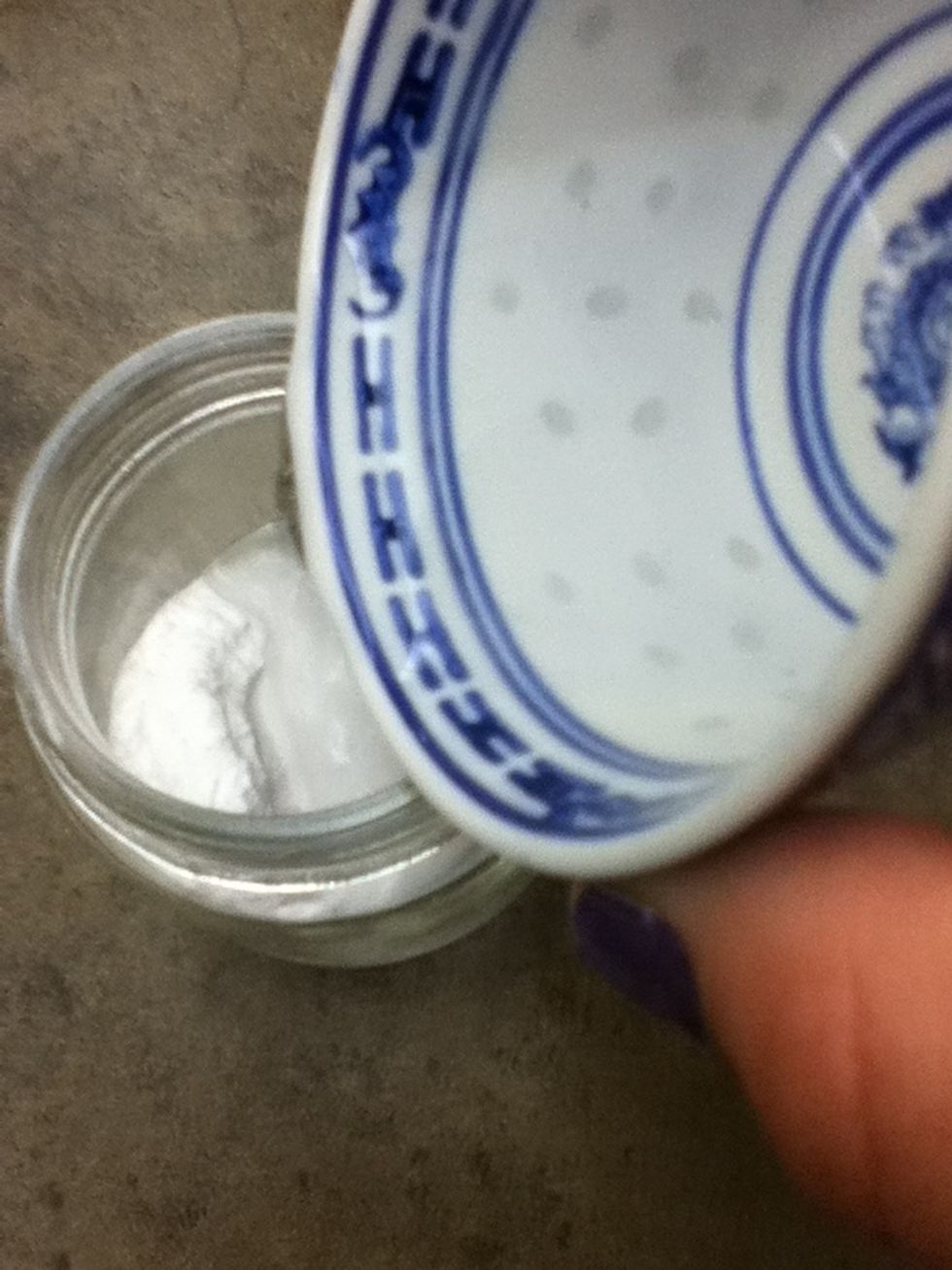 Pour in water, slowly to make a paste.