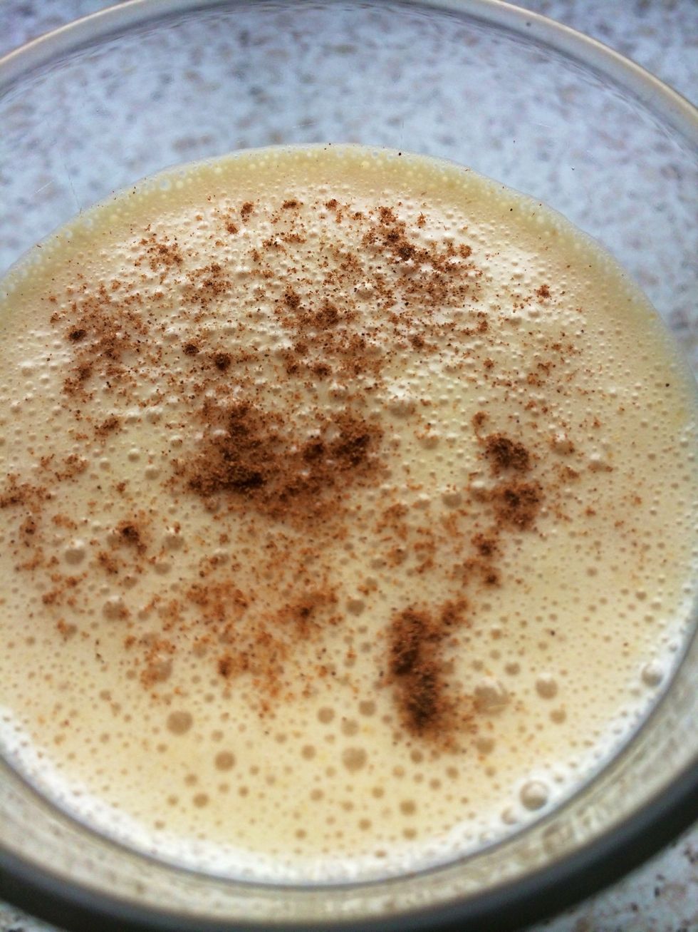 Pour into a glass and add a dusting of cinnamon.