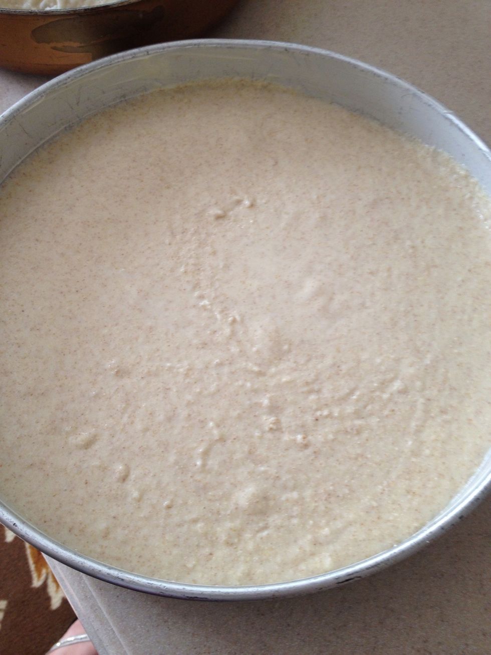Pour into a greased baking dish. Make it shallow enough so that the Basbousa is no more than 1" thick and LEVEL.