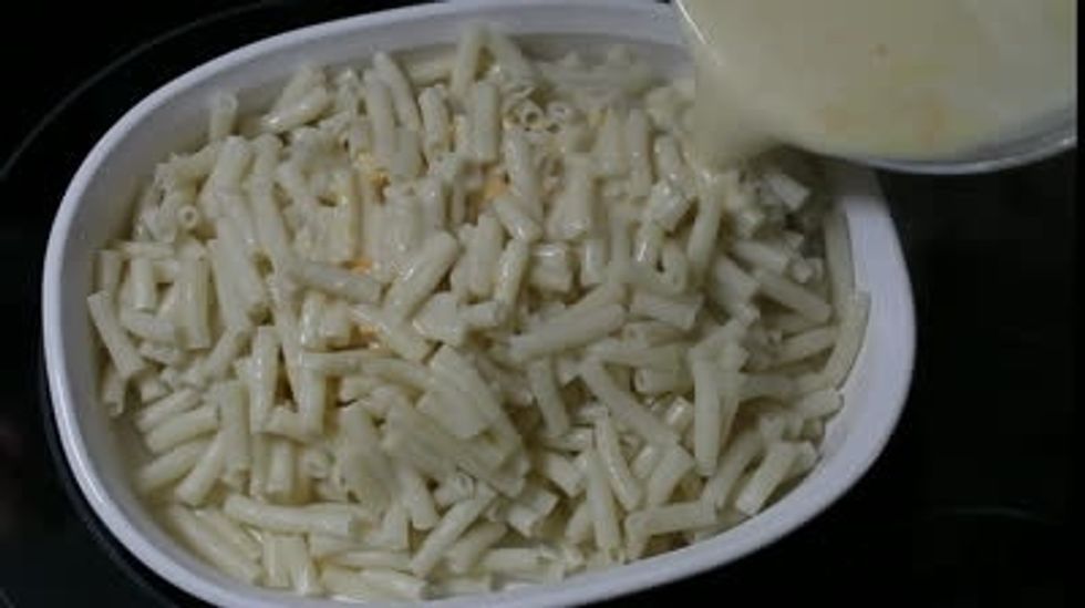 Pour Into macaroni and make sure u coat it well.