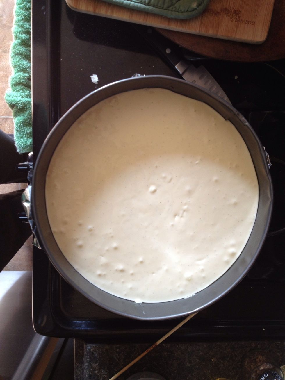 Pour into springform pan with crust already set.  Bake in a preheated oven at 350 for 45 minutes if using a 10" pan. If using an 8 or 9" pan, bake for 50 minutes.