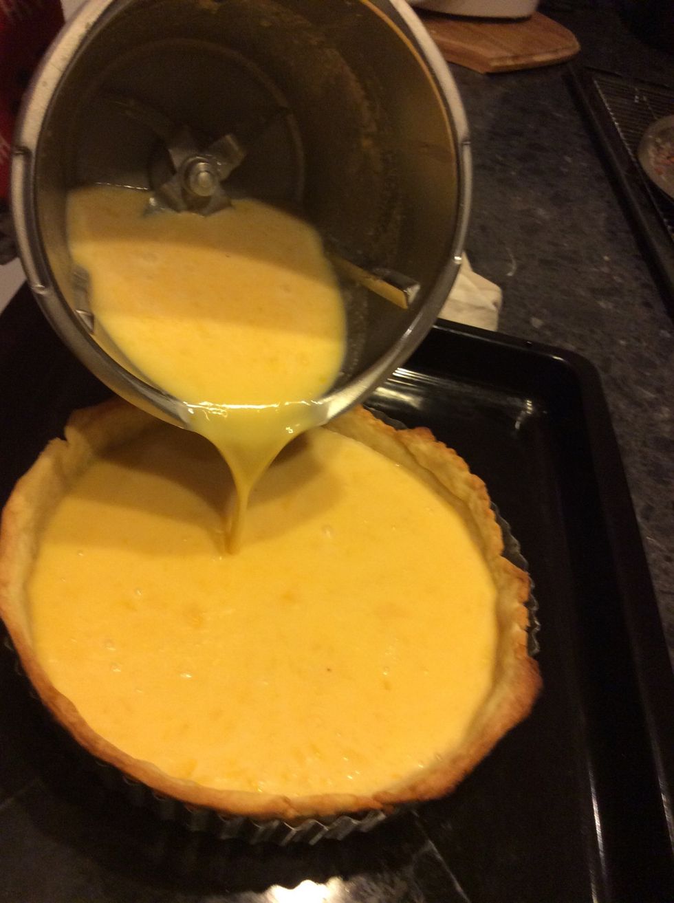Pour into the just baked pastry base.