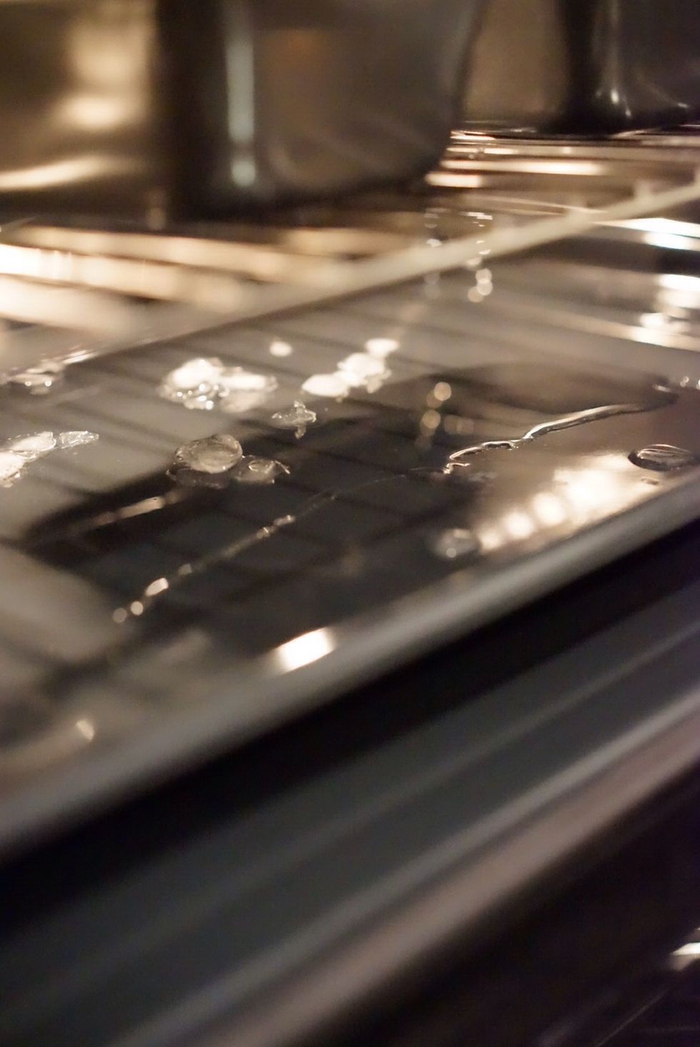 Pour into the pan prepared inside the oven. Put in the baking pans with dough. They will now be baking in steam.
