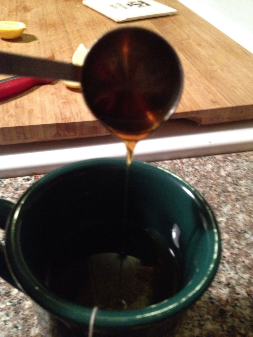 Pour into the tea. Then stir. Since honey is thick I just use the tablespoon to stir with. That way all the honey comes off the spoon.