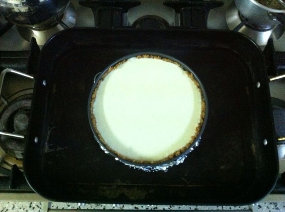 Pour into your crust and place the sprinform pan into a larger roasting pan. You will notice that the filling is too thin and liquid like. It's exactly how it should be, DO NOT thicken with flour!