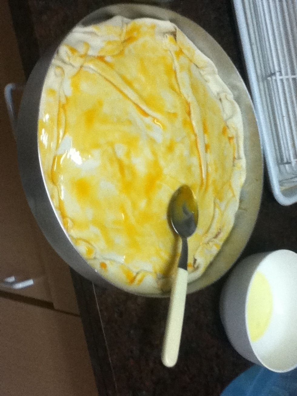 Pour it all over the top, i Am using a spoon to do iti