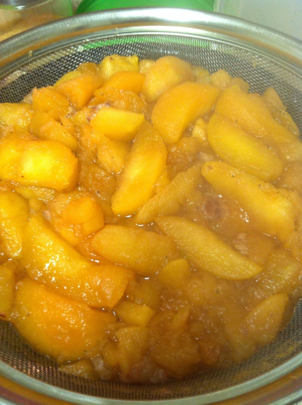 Pour it in the strainer. At this point decide how 'wet' you want your apple sauce. I just let it drain, but you could smash some extra liquid out if you'd like.