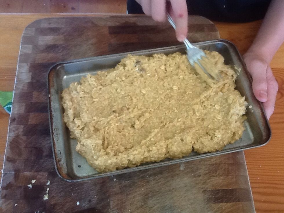 Pour it onto the 'slab' tin and even it out to all the edges.