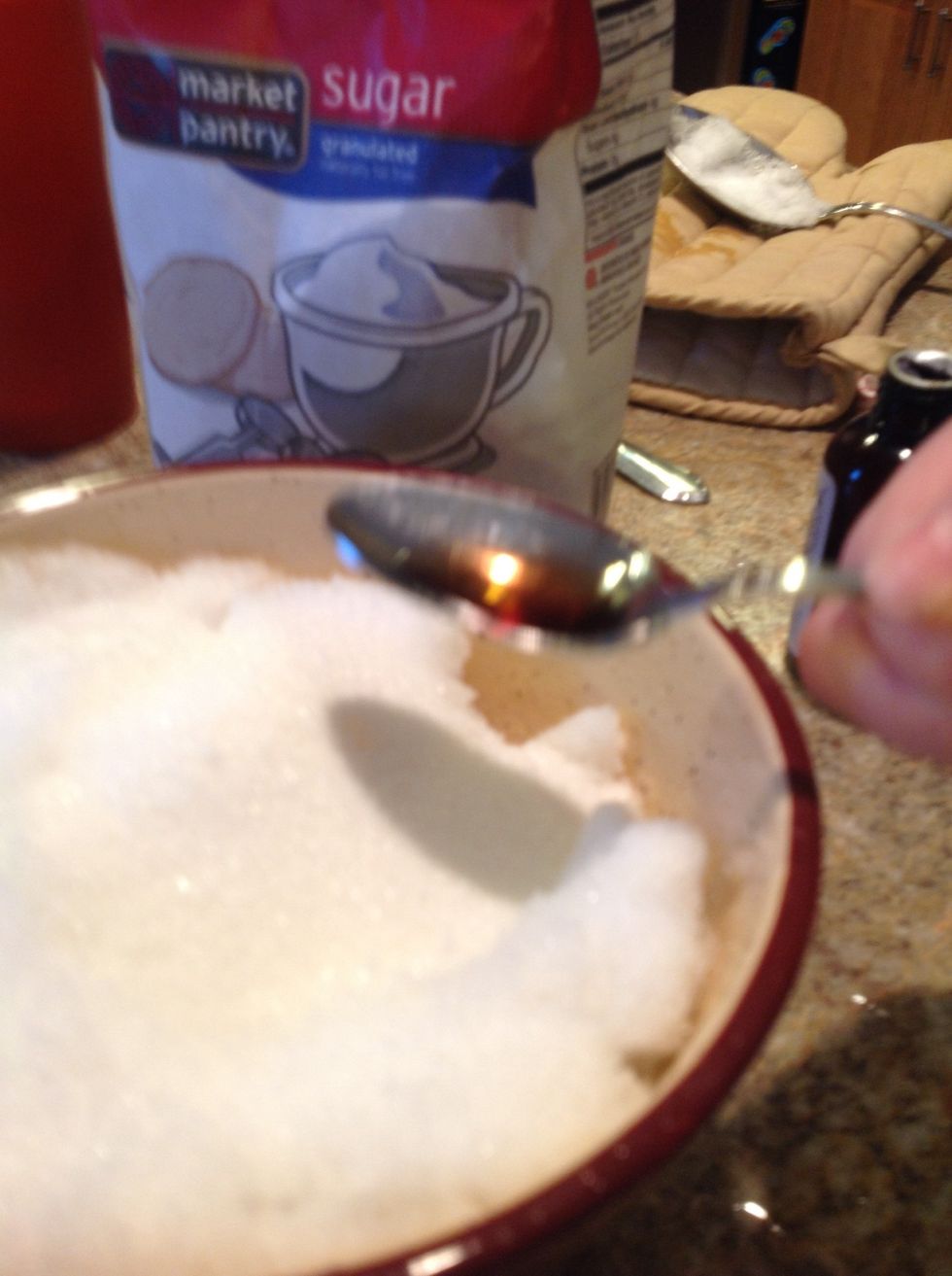 Pour less than 1 teaspoon of vanilla extract into the bowl.