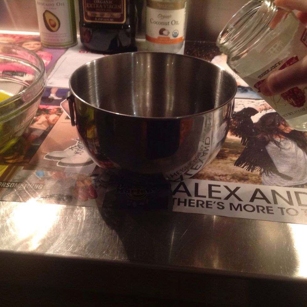 Pour lye + water mixture and oil mixture into metal bowl.