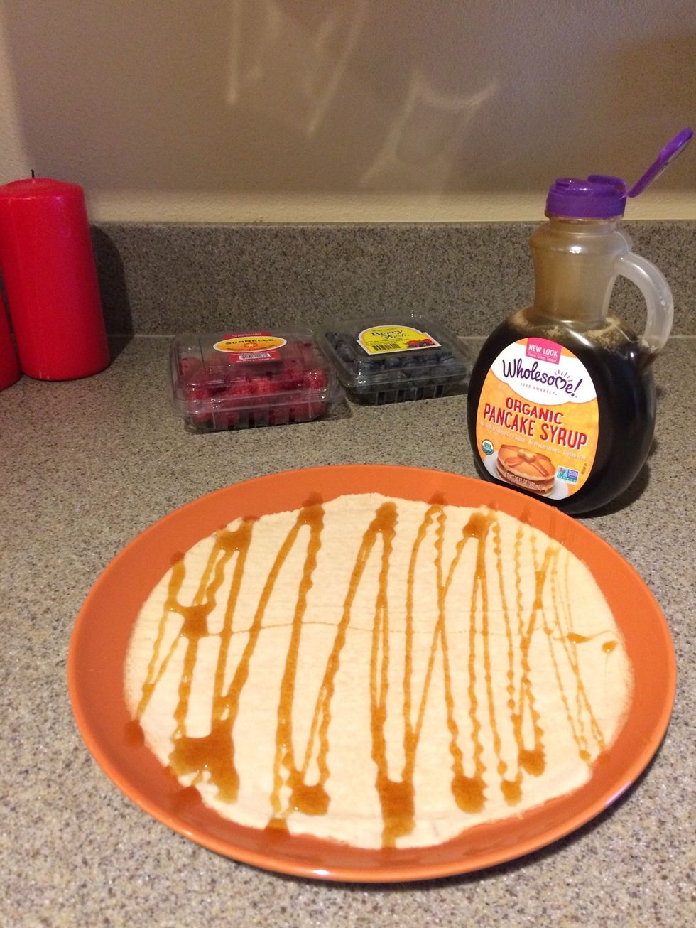 Pour maple syrup over the paper.