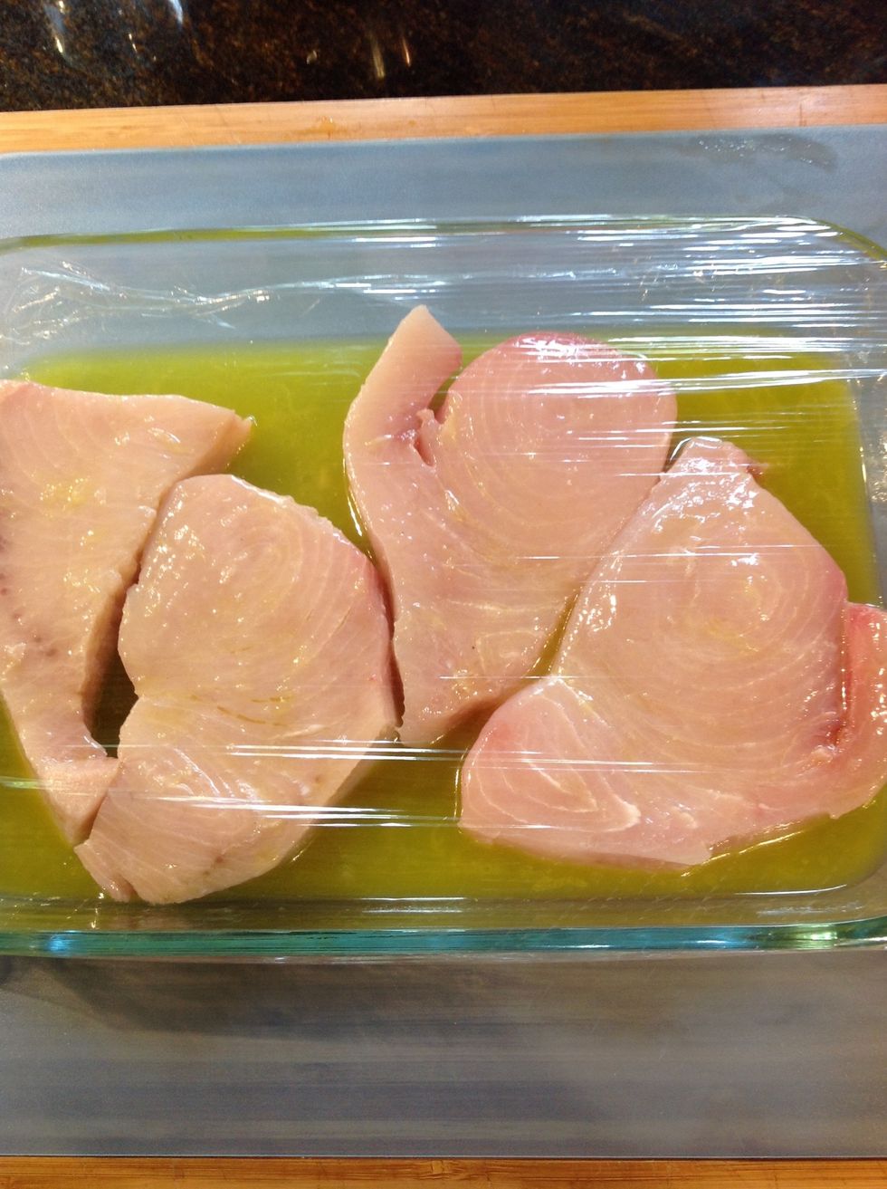 Pour marinade over trimmed swordfish or marlin turning to coat all sides evenly cover with plastic wrap and marinade in refrigerator for 1 hour turning once.