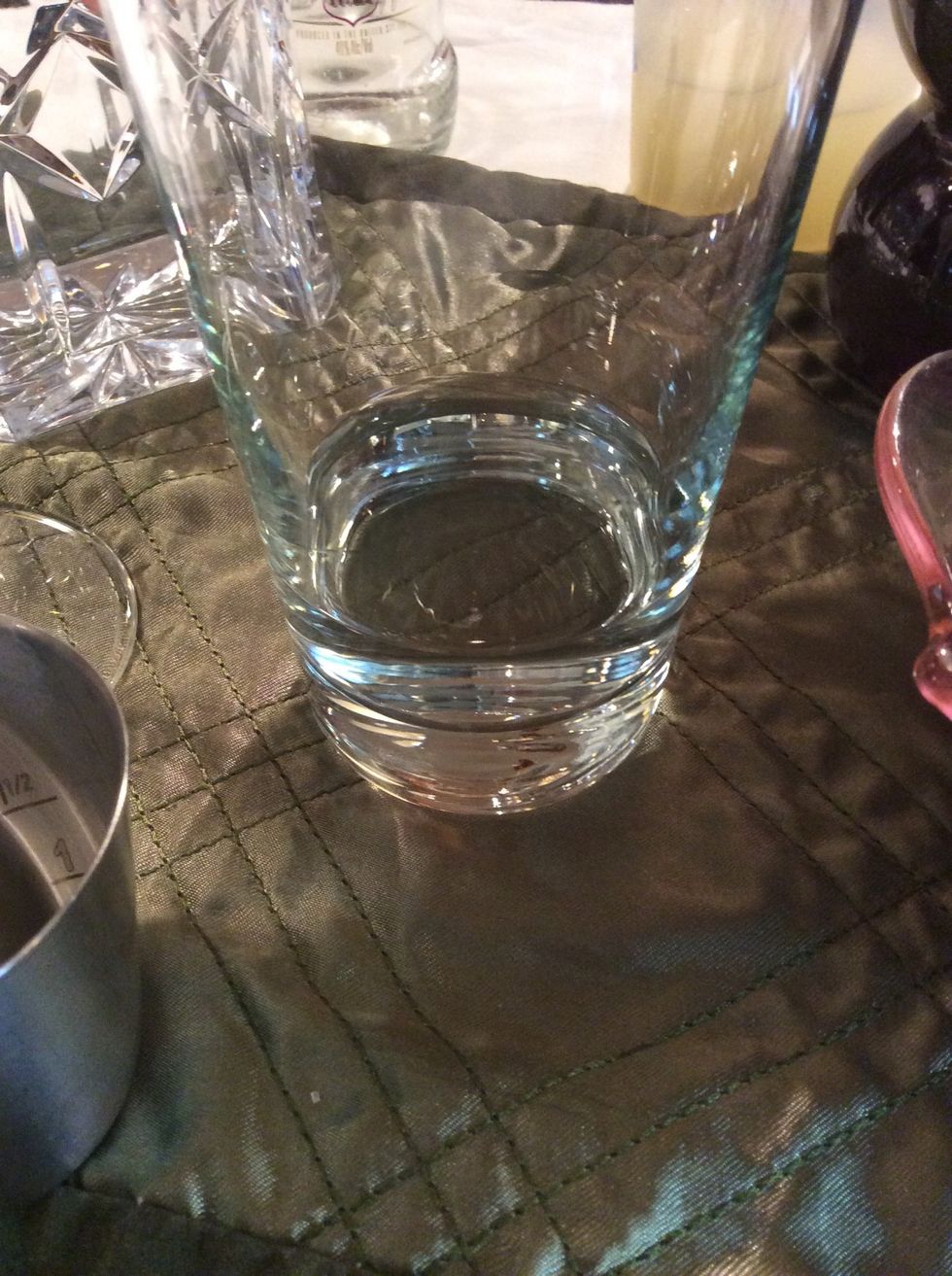 Pour measured vodka in shaker.