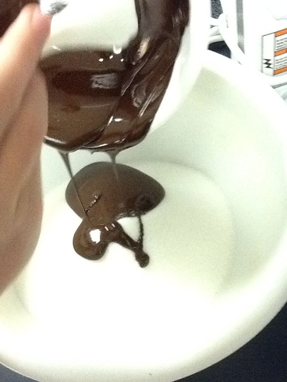 Pour melted chocolate in bowl with sugar