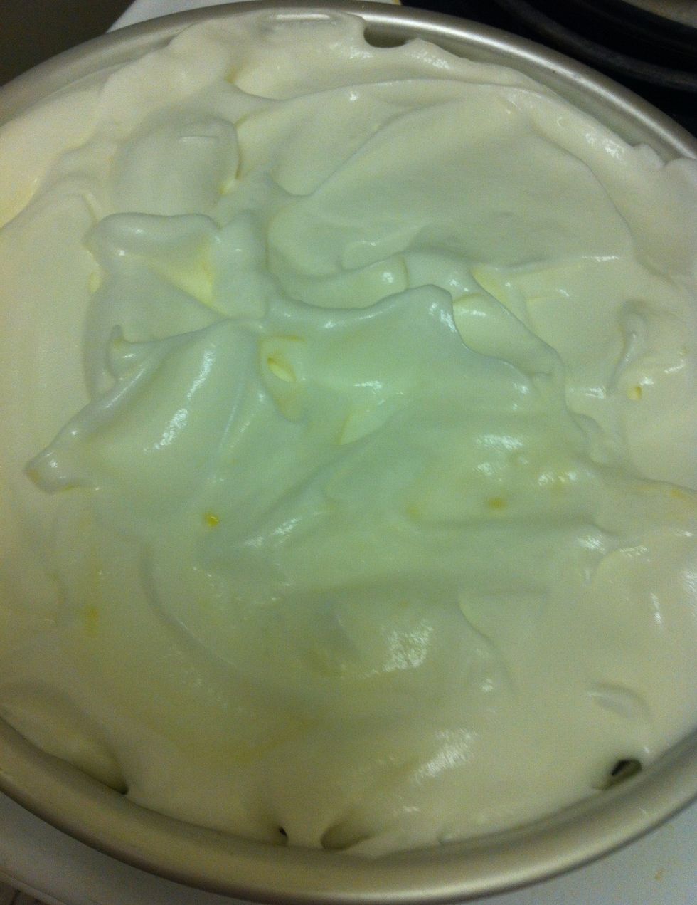 Pour meringue on top of hot curd. Be sure the curd is hot to prevent the meringue from weeping.