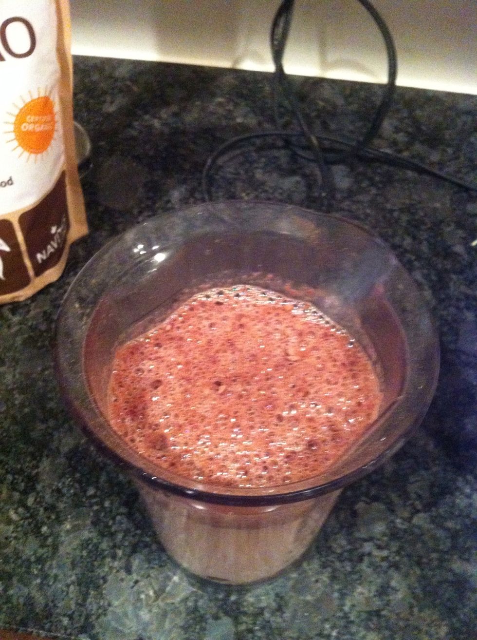 Pour microwaved milk into mixing cup