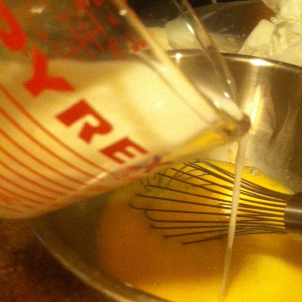 pour milk in bowl with thoroughly whisked eggs