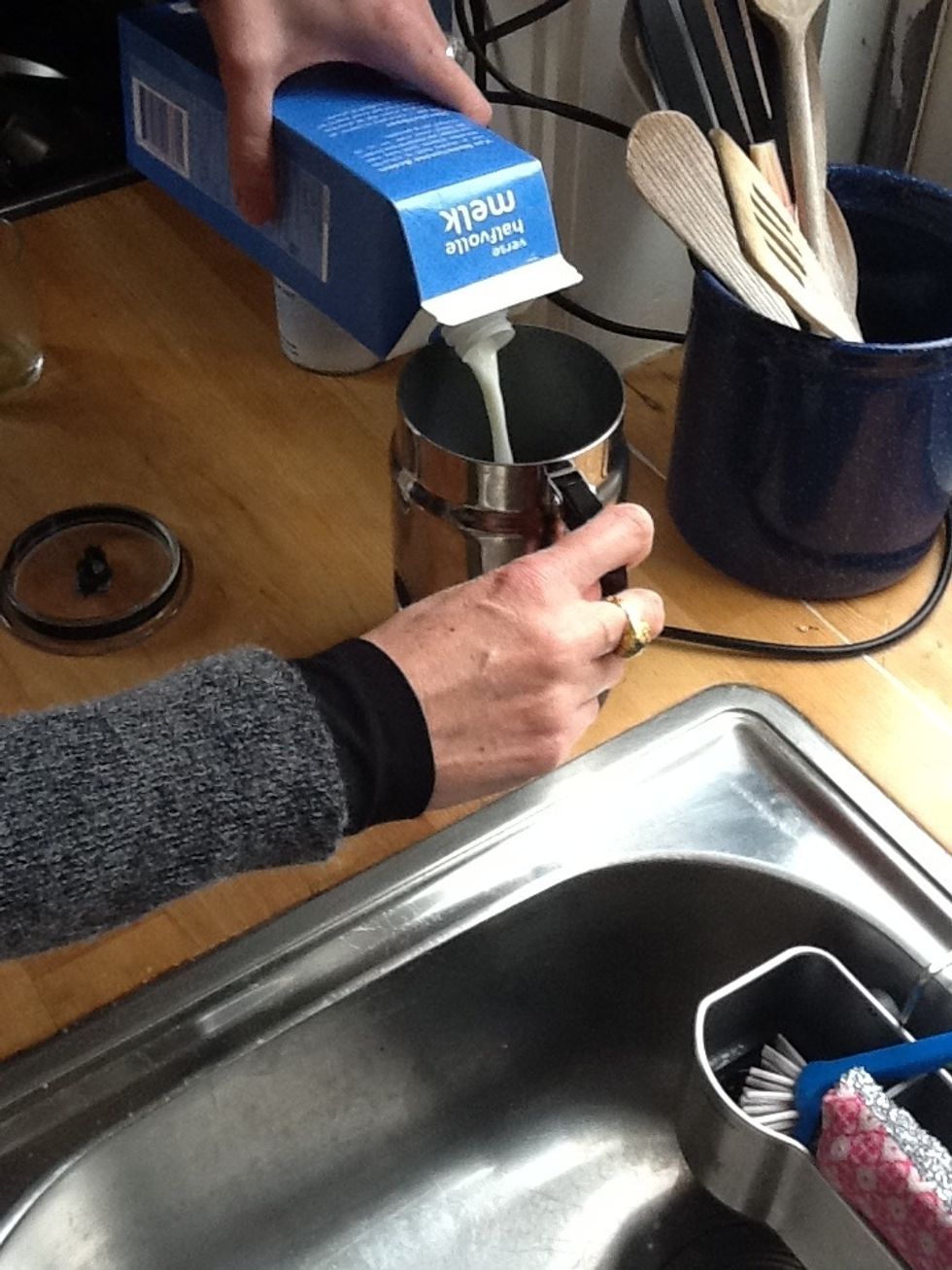 Pour milk in creamer