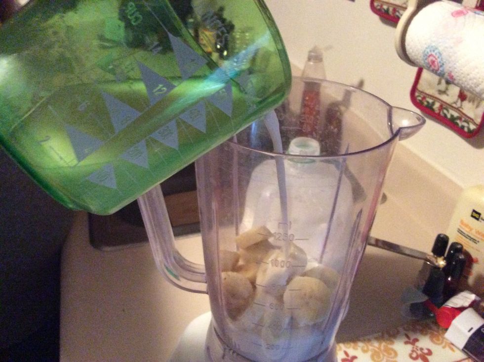 Pour milk into blender