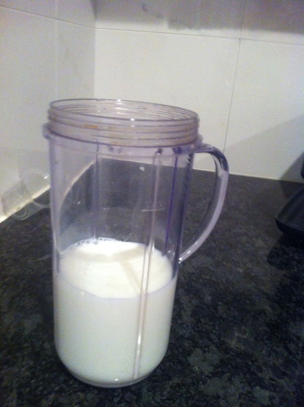 Pour milk into blender