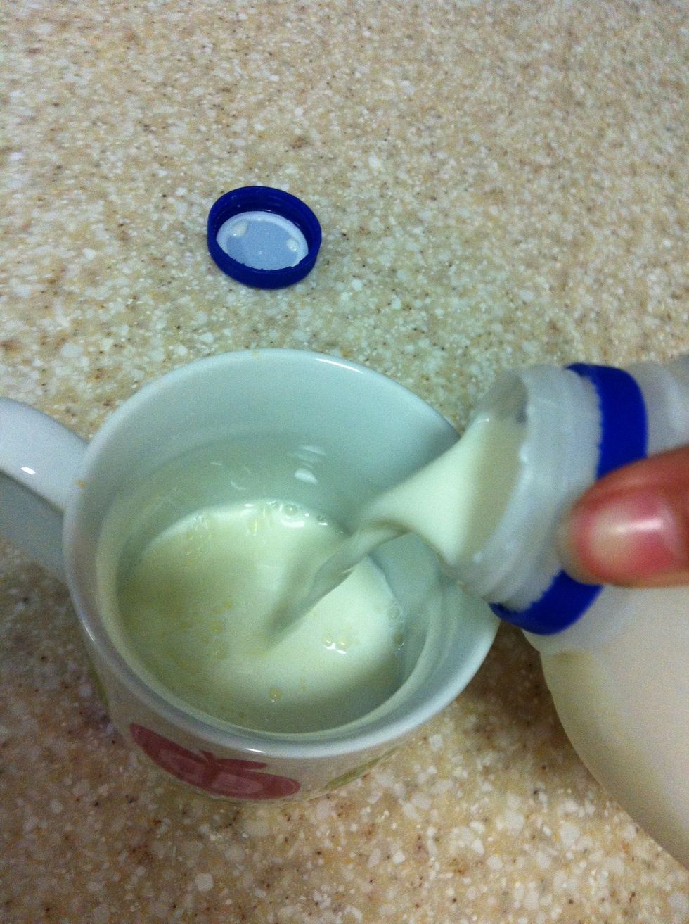 Pour milk into cup