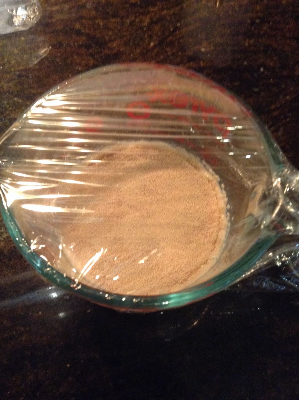Pour milk into microwave safe container add sugar and microwave about 25 seconds. Remove, stir and use thermometer to check temperature you want it between 95F-110F sprinkle yeast on top & cover.