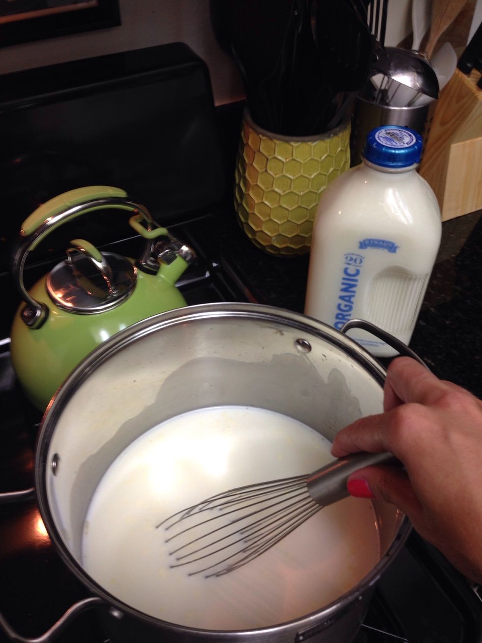 Pour milk into pot and heat very slowly, stirring gently until it starts to steam (don't boil). This should take about 15-20 minutes.