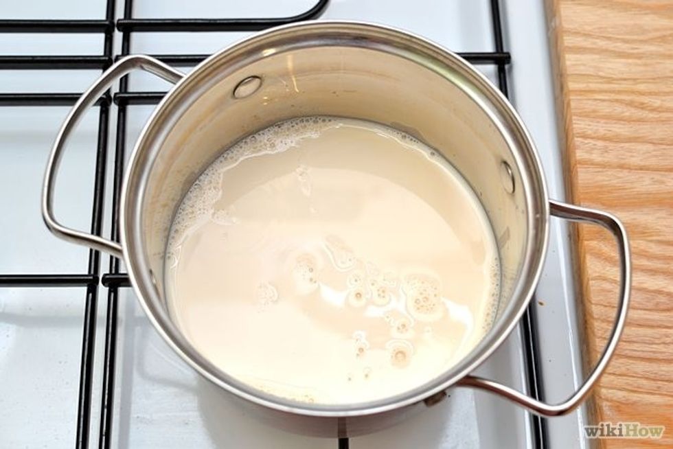 Pour milk into saucepan and heat over medium for a few minutes until milk gets steamy.