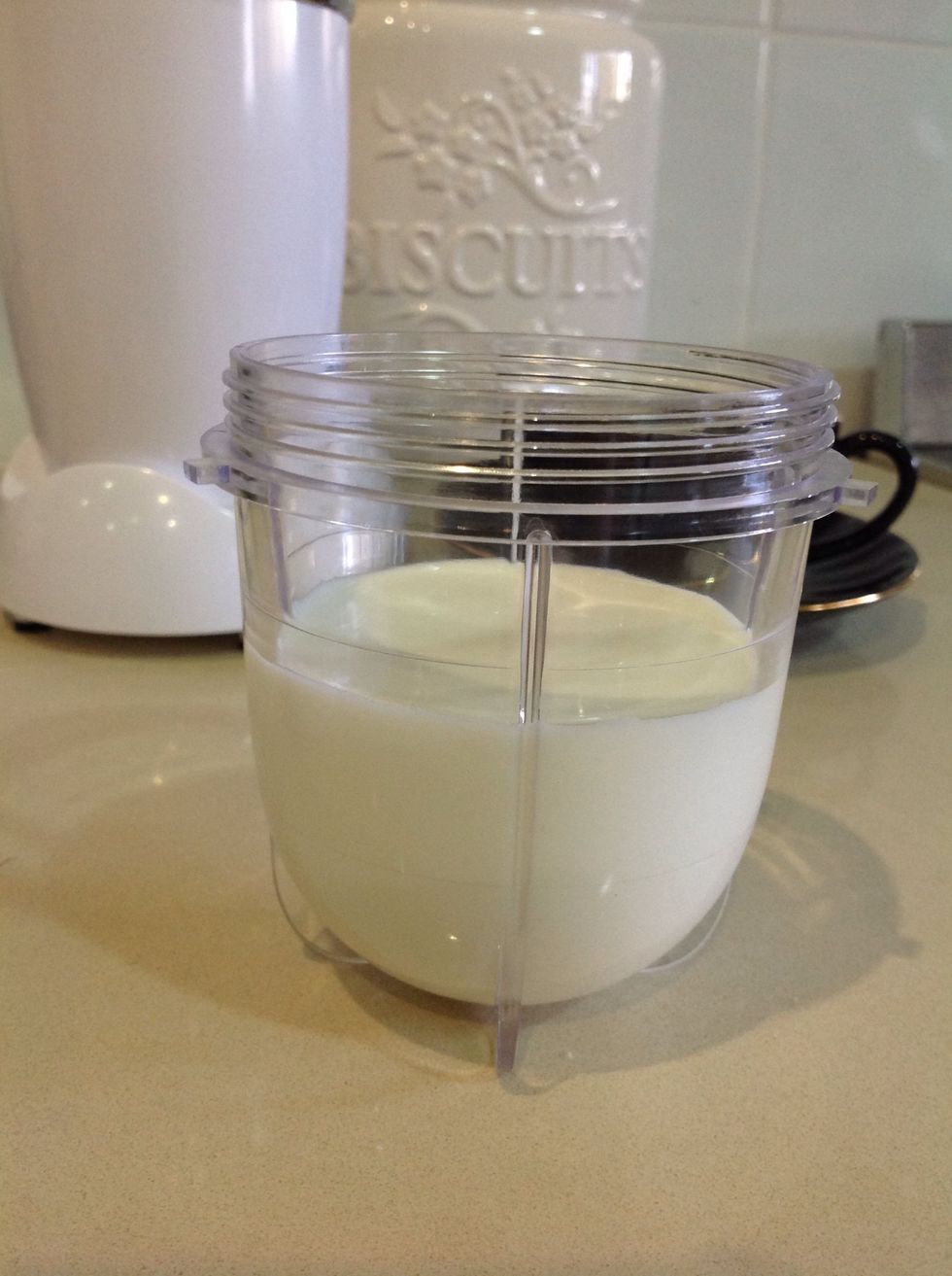 Pour milk up to about 1cm below the top indicator.