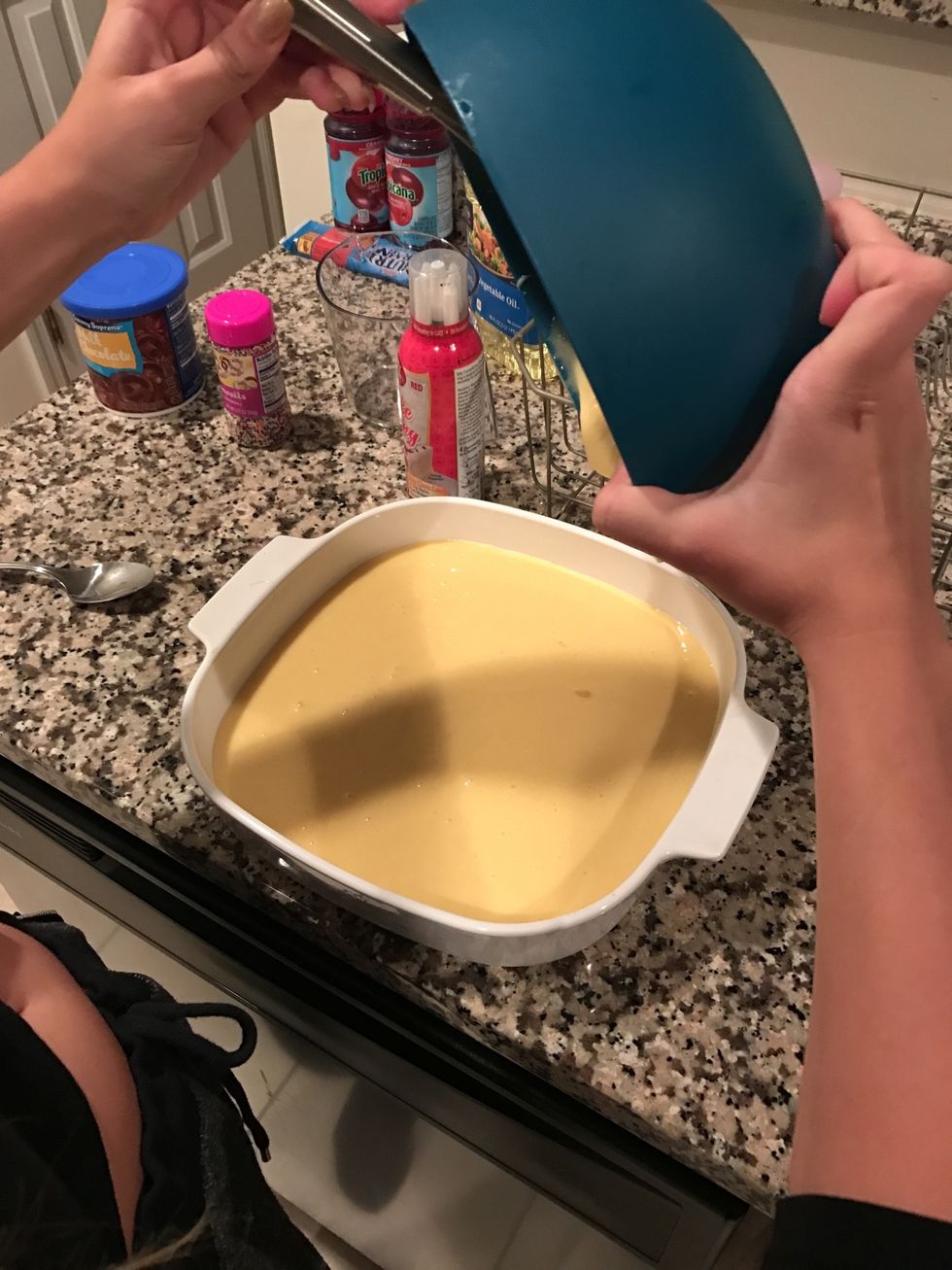 Pour mixed ingredients into a baking pan