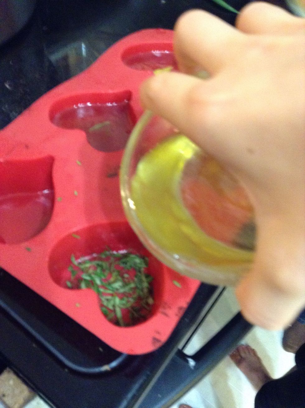 Pour mixture from bowl into mold (Optional put rosemary or flower petals for decoration )