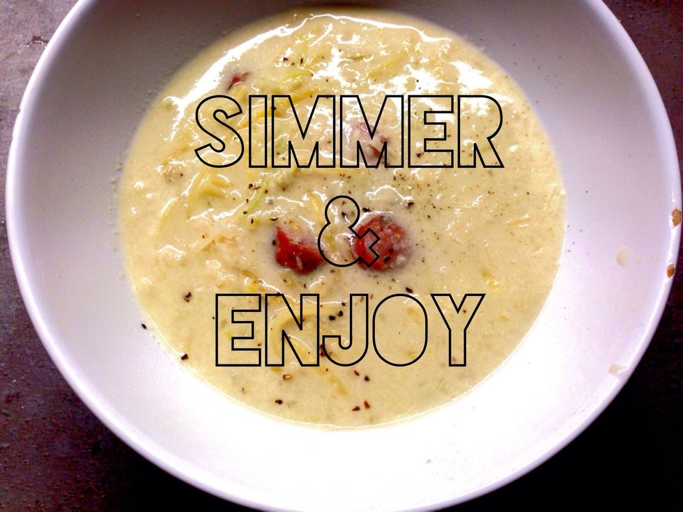 Pour mixture into a pot. Add Parmasan grind. Mix 1 tbsp of flour in a cup of water and add to pot. Add Creme and 2 cups of water. Add sausage. Bring to boil and stir. Reduce heat. Simmer for 5min