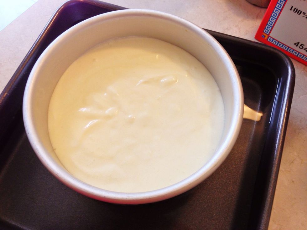 Pour mixture into baking pan then put it into a hot water bath. You can just use the hot water from the double boiler.