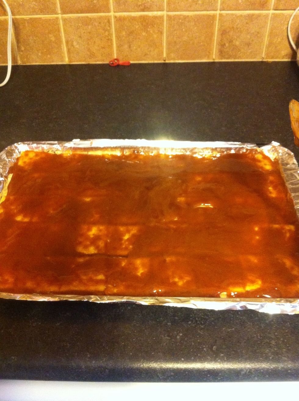 Pour mixture over crackers and spread. Put in 350 oven for 7-8 minutes until bubbly.