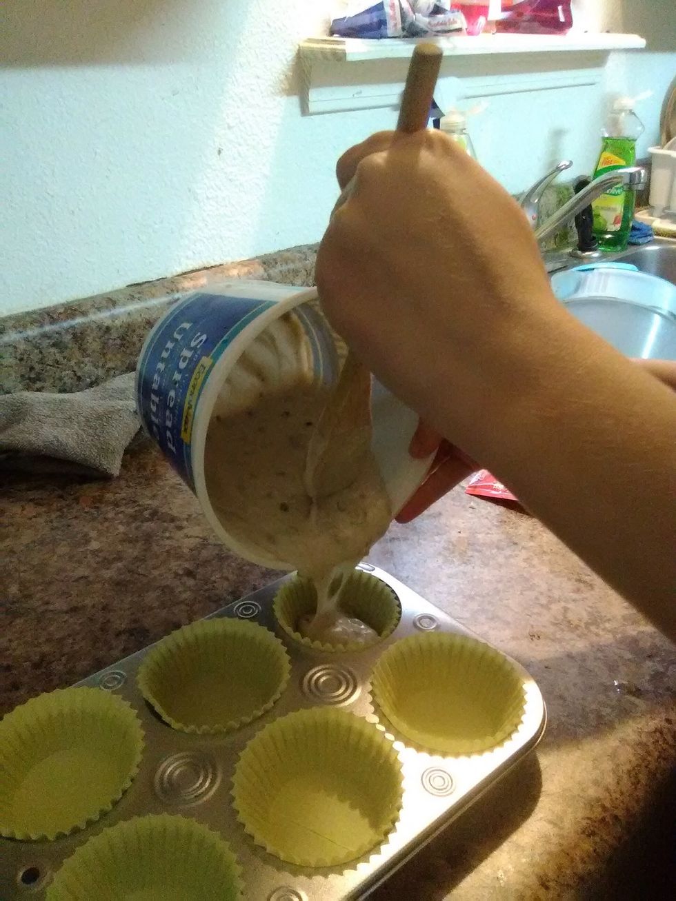 Pour muffin mixture into paper cups