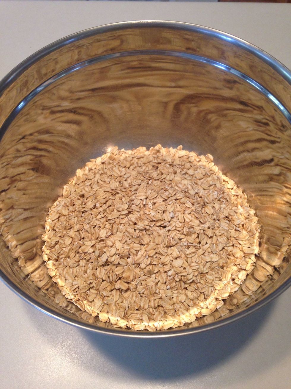 Pour oats into a large mixing bowl.