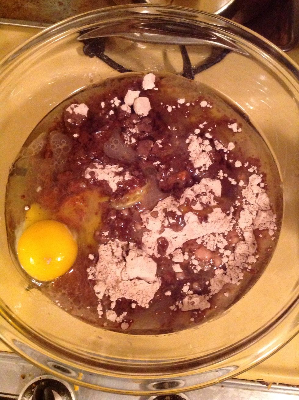 Pour oil and water into the bowl.