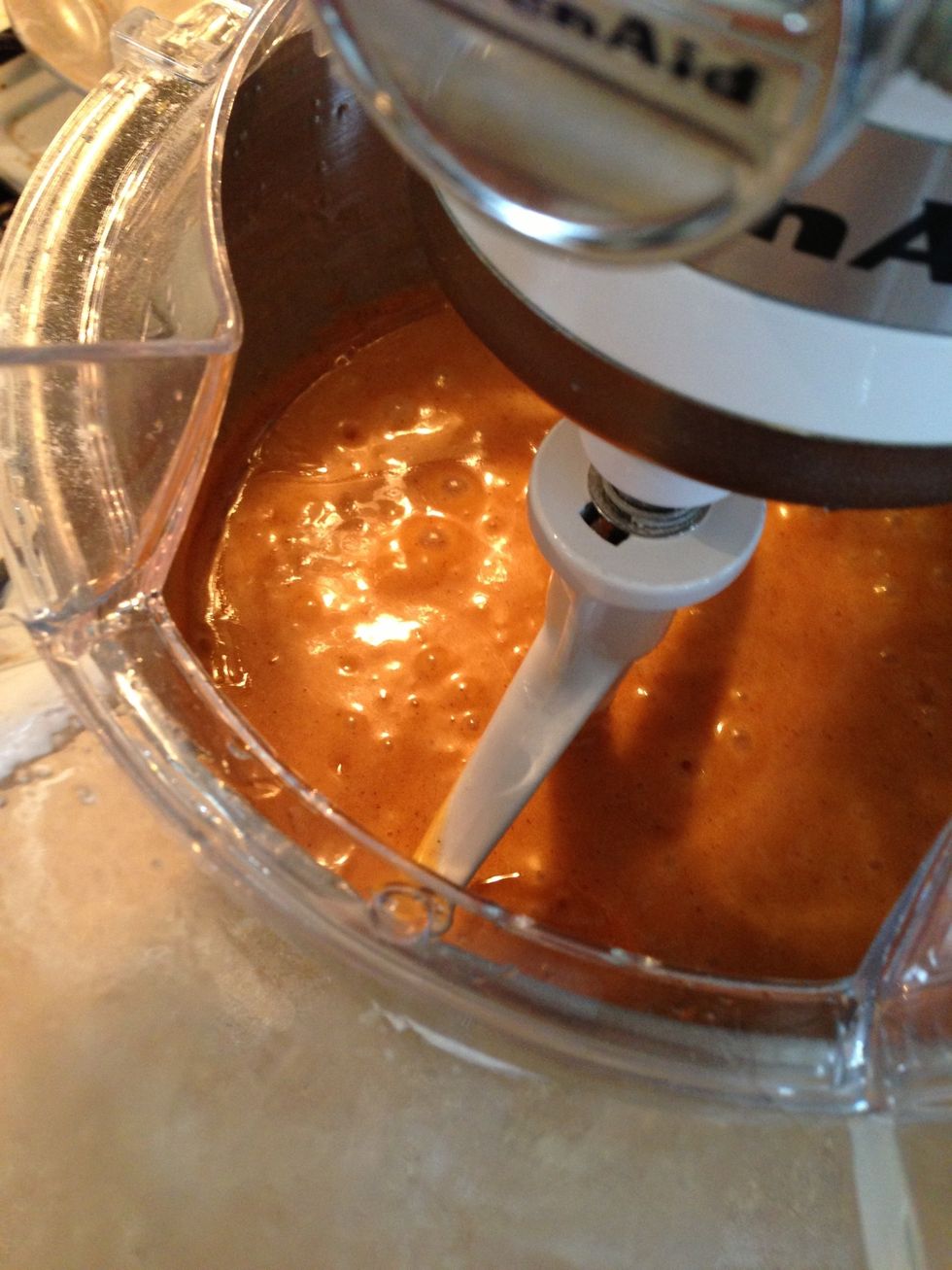 Pour oil in gradually and slowly while your mixer is turning at a slow speed. Once all oil is poured in to batter, mix well for about two minutes.