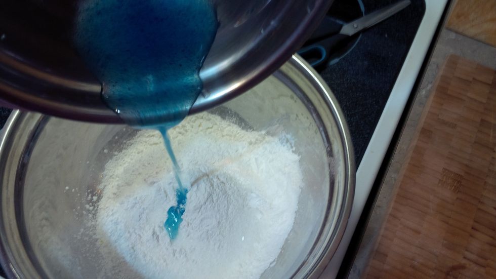 Pour oil mixture into the dry mixture.