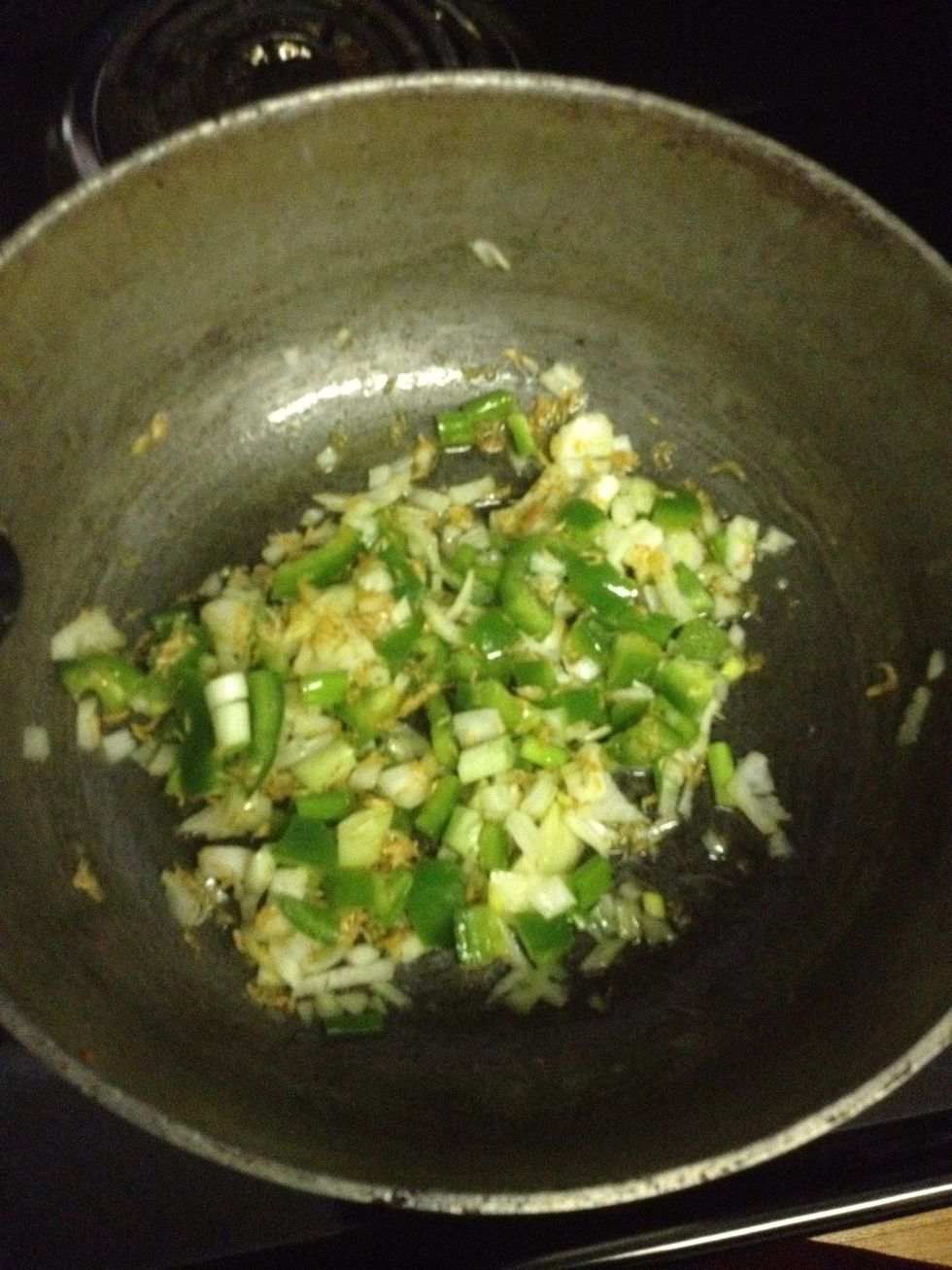 Pour oil n fry the green onion,onion,green pepper and 1 bouillon cube all together