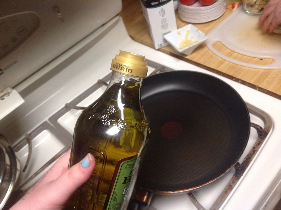 pour olive oil in a pan at medium heat (use a big pan, trust me)