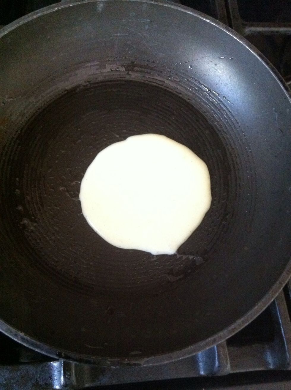Pour out about 1/4 cup batter into your pan.