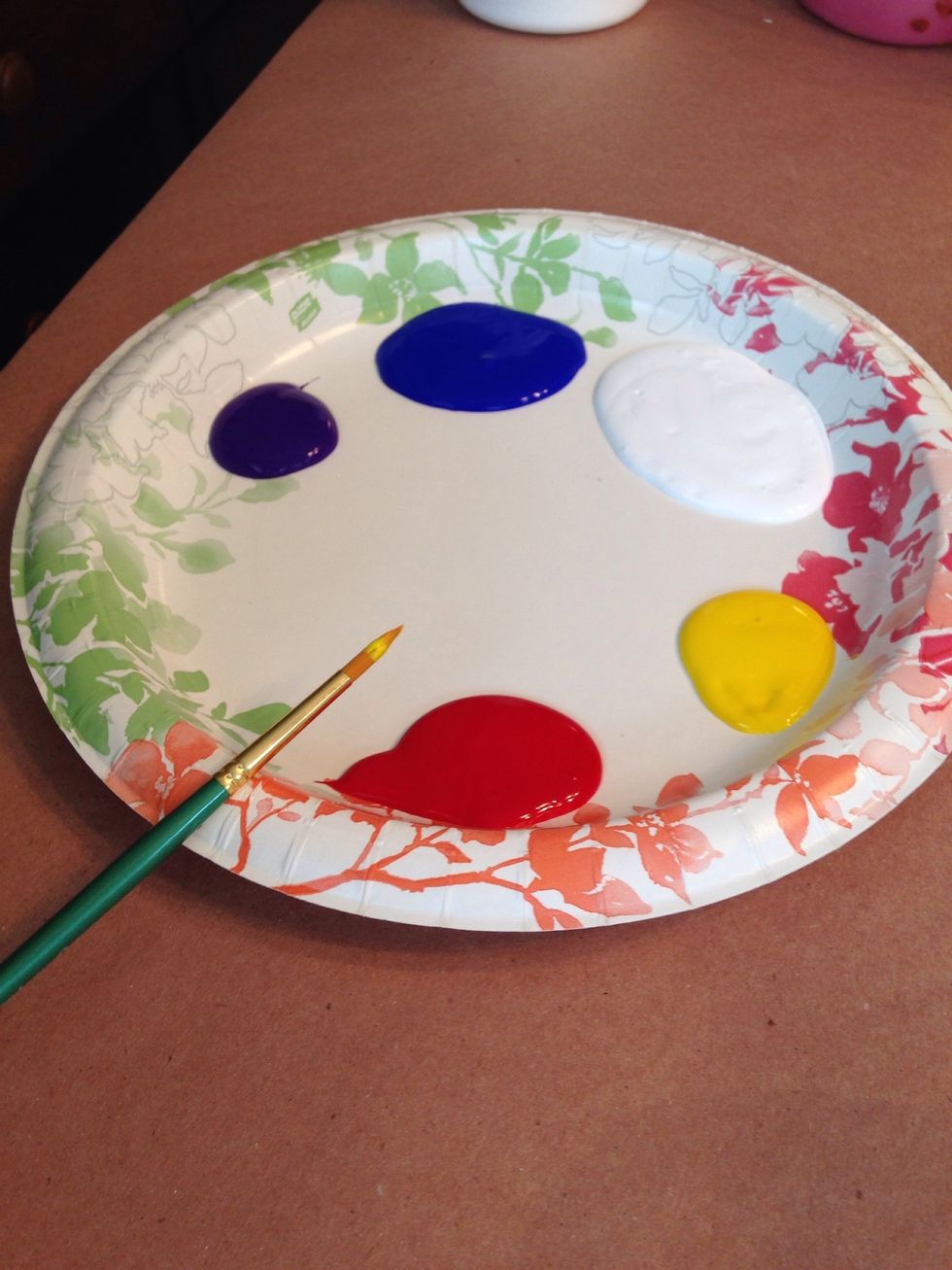 Pour paint into a paper plate.