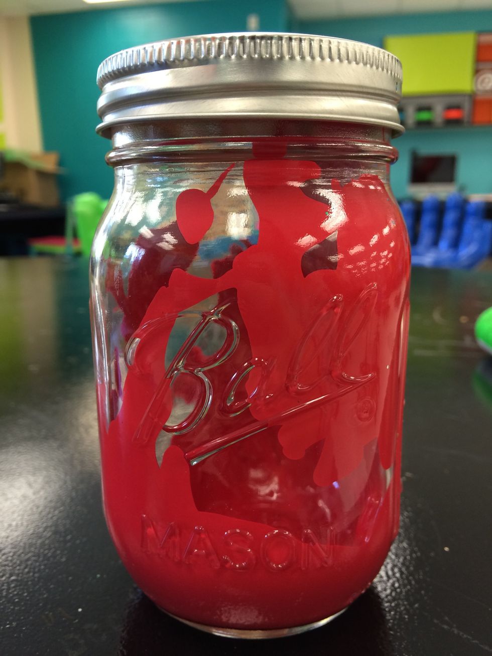 Pour paint into the jar. Shake jar until it is fully covered inside.