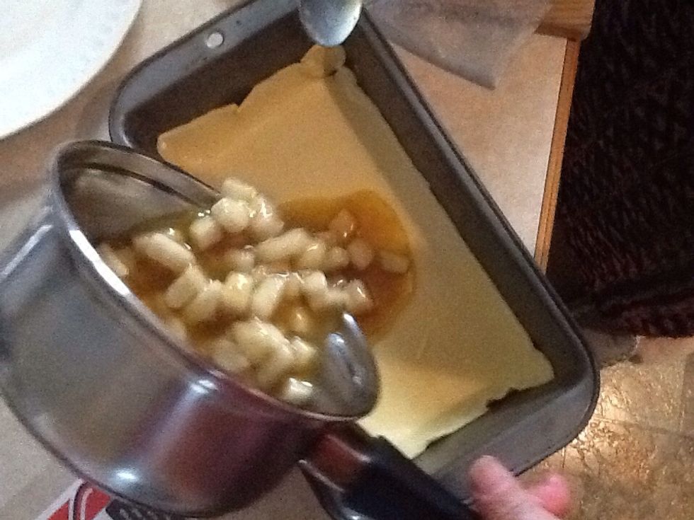 Pour pear mixture onto pastry and smooth with spoon