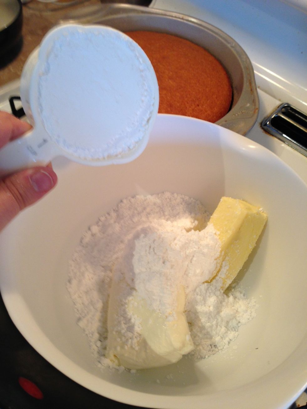 Pour powdered sugar over the butter and cream cheese.