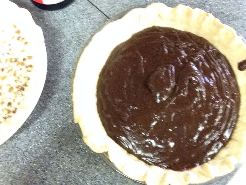 Pour pudding in baked pie shell.